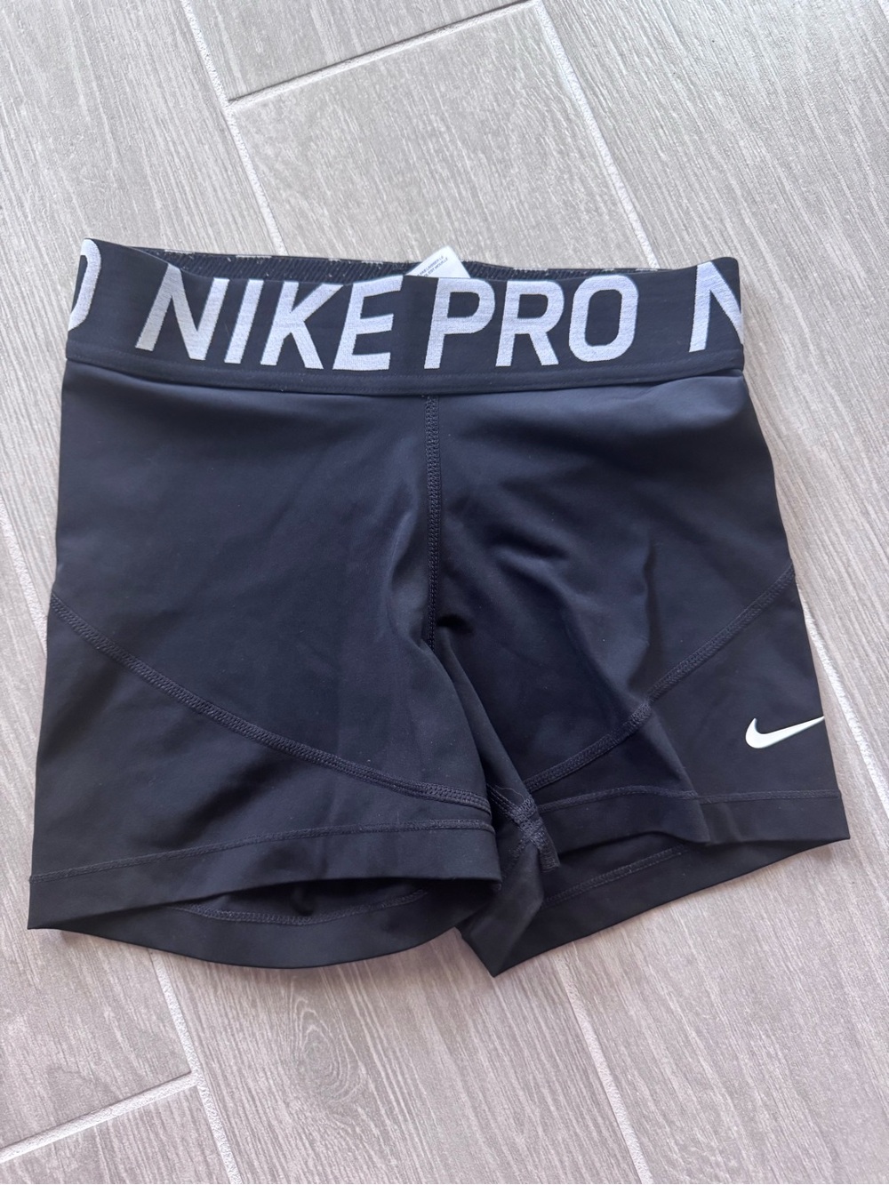 Nike Pro Women's Black Athletic Shorts with White Swoosh